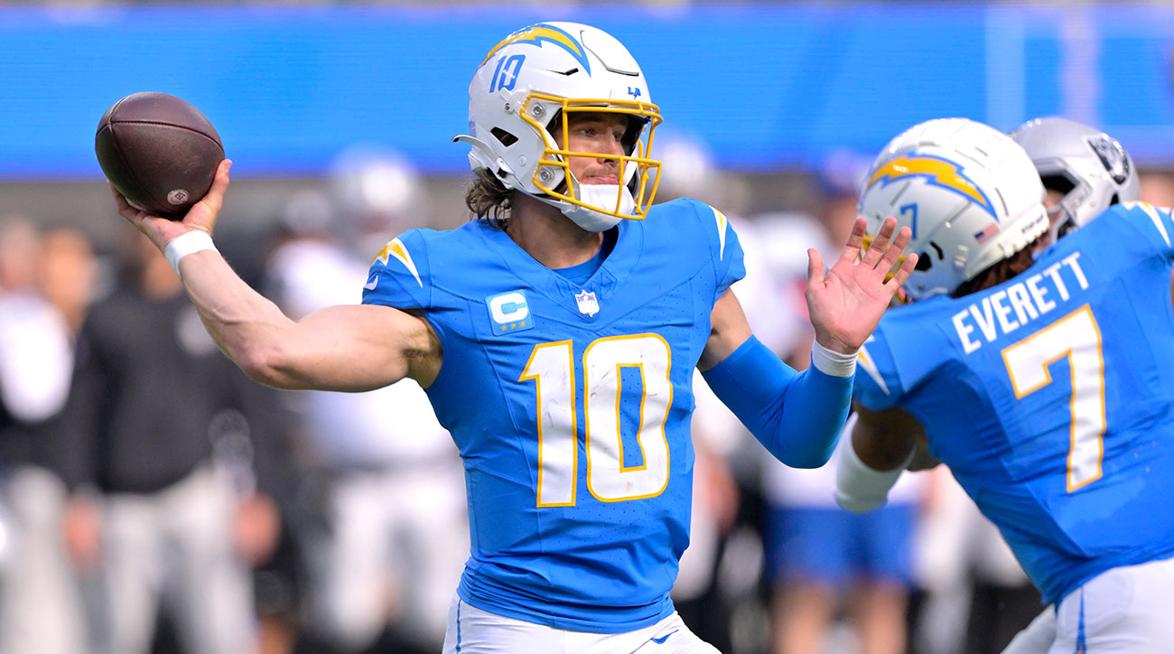 Justin Herbert throws a pass against the Raiders